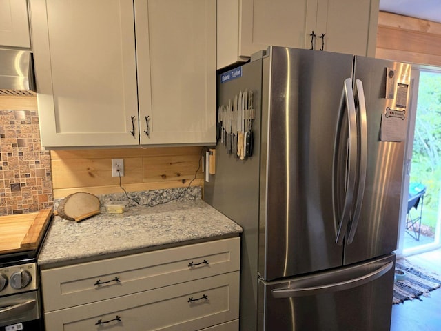 340 Campground Rd, Anson, ME 04958 - kitchen featuring freestanding refrigerator and tasteful backsplash