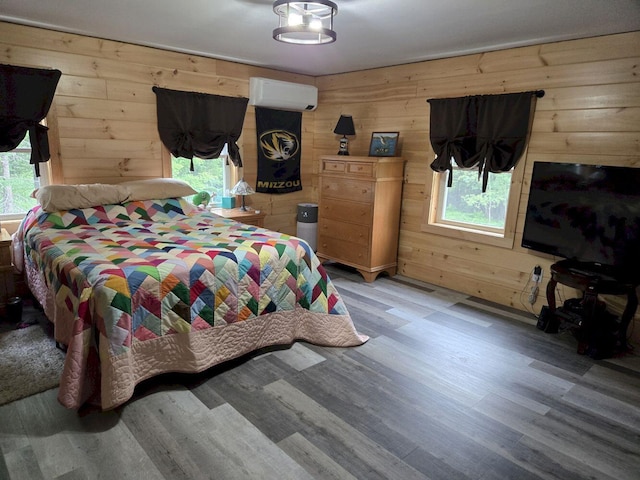 340 Campground Rd, Anson, ME 04958 - bedroom with wooden walls, light wood finished floors, and a wall mounted AC
