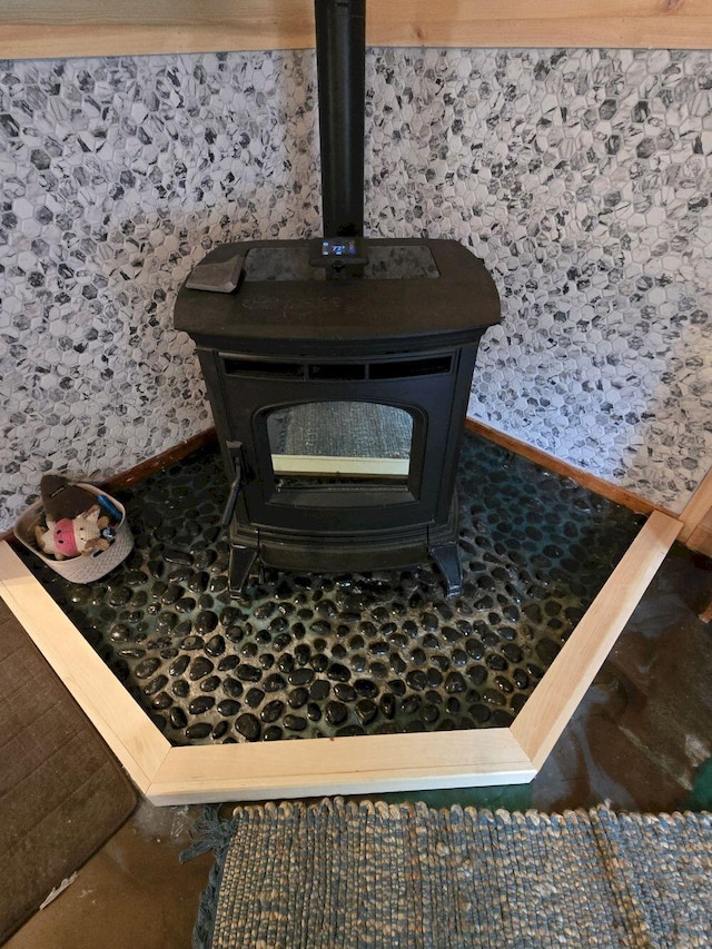 340 Campground Rd, Anson, ME 04958 - detailed view of a wood stove and baseboards