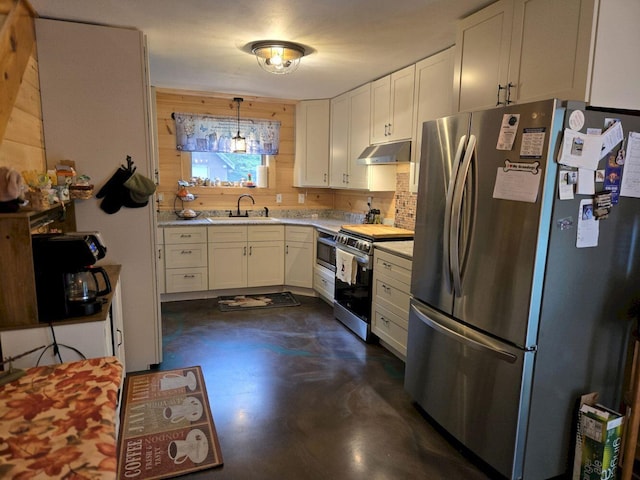 340 Campground Rd, Anson, ME 04958 - kitchen with appliances with stainless steel finishes, light countertops, concrete flooring, under cabinet range hood, and wooden walls
