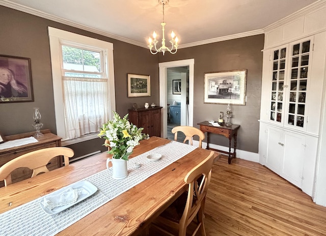 72 Federal Rd, Parsonsfield, ME 04047 - dining area featuring a chandelier, ornamental molding, and light wood-type flooring