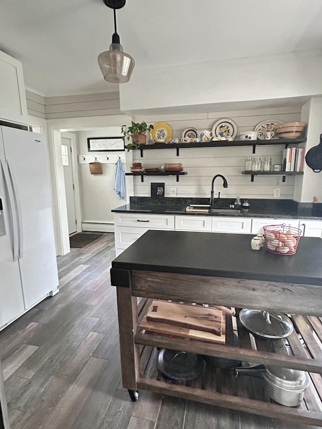 72 Federal Rd, Parsonsfield, ME 04047 - kitchen featuring white refrigerator with ice dispenser, open shelves, dark countertops, white cabinetry, and dark wood-type flooring