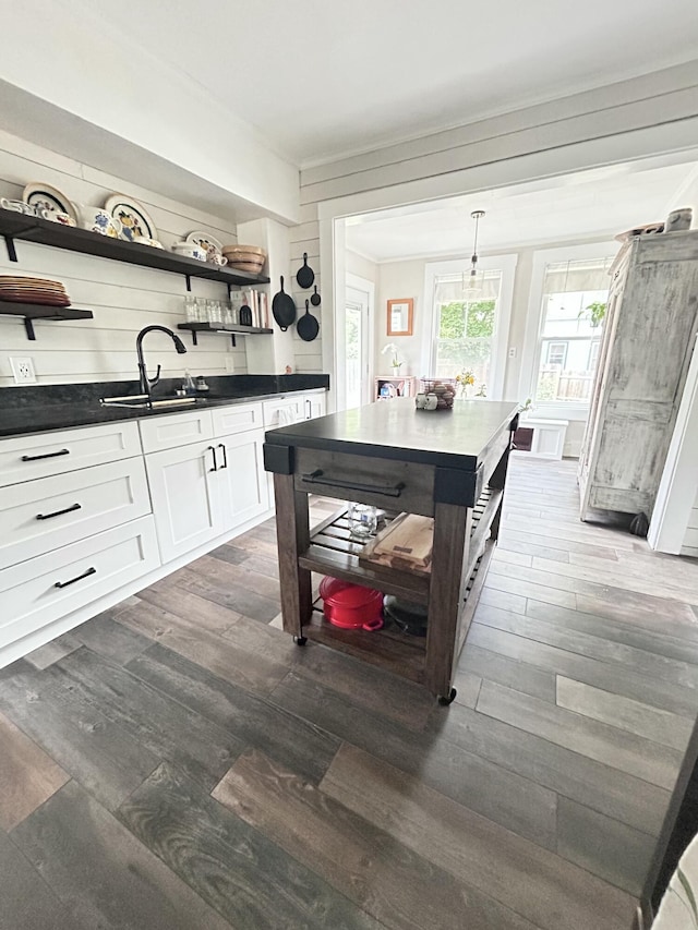 72 Federal Rd, Parsonsfield, ME 04047 - kitchen with open shelves, dark countertops, dark wood-style flooring, white cabinetry, and crown molding
