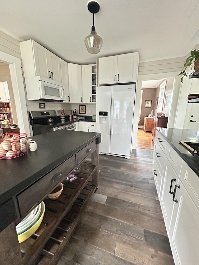 72 Federal Rd, Parsonsfield, ME 04047 - kitchen featuring white appliances, dark countertops, dark wood-style flooring, and white cabinets