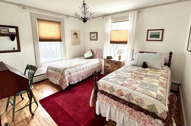 72 Federal Rd, Parsonsfield, ME 04047 - bedroom with wood-type flooring, crown molding, and baseboard heating