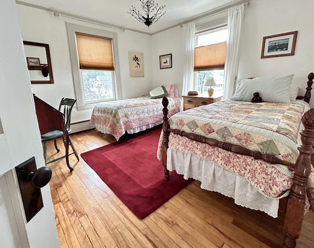 72 Federal Rd, Parsonsfield, ME 04047 - bedroom featuring hardwood / wood-style flooring, multiple windows, and a baseboard radiator