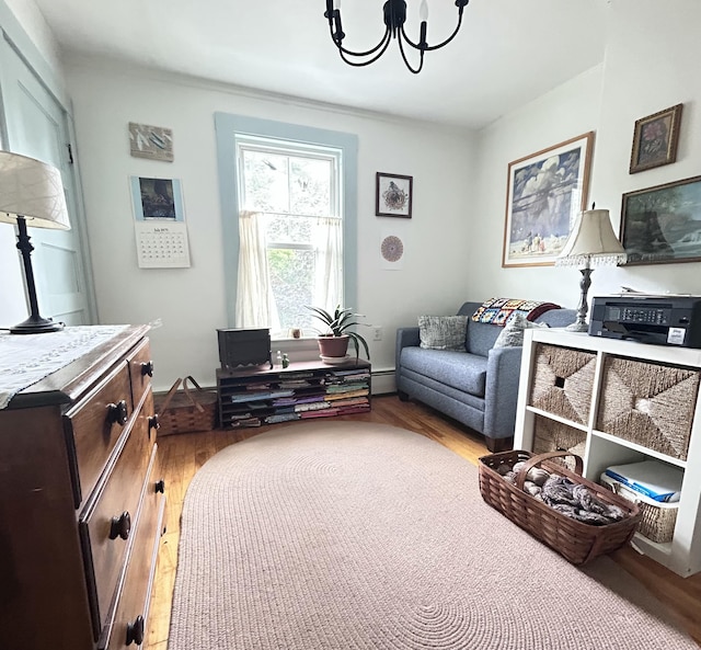 72 Federal Rd, Parsonsfield, ME 04047 - sitting room featuring a chandelier, a baseboard heating unit, and wood finished floors