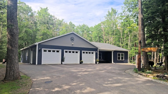 62 Cobb Rd, Stetson, ME 04488 - view of front of home featuring an attached garage and asphalt driveway
