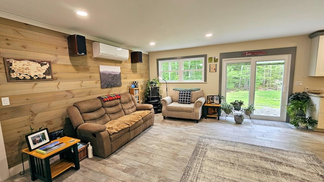 62 Cobb Rd, Stetson, ME 04488 - living room with a wall mounted air conditioner, recessed lighting, light wood-style flooring, and wood walls