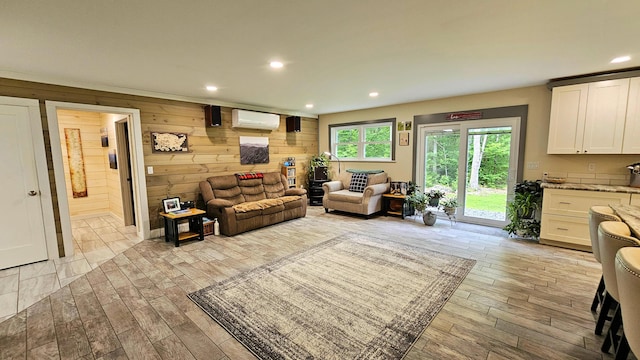 62 Cobb Rd, Stetson, ME 04488 - living area featuring an AC wall unit, light wood-style flooring, recessed lighting, and wooden walls