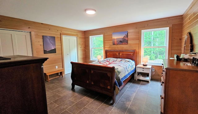 62 Cobb Rd, Stetson, ME 04488 - bedroom featuring wooden walls and multiple windows