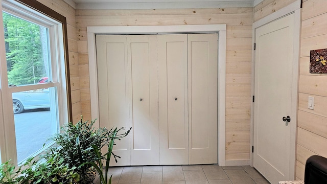 62 Cobb Rd, Stetson, ME 04488 - entryway with wood walls and light tile patterned floors