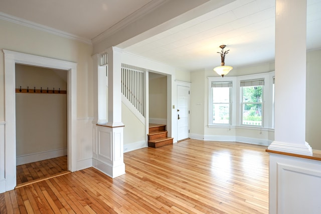 18 Colonial Rd Unit 18, Portland, ME 04102 - spare room featuring light wood-style floors, crown molding, stairway, and decorative columns