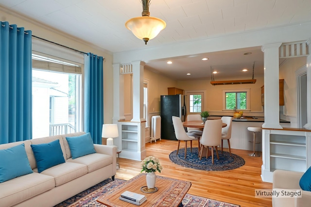 18 Colonial Rd Unit 18, Portland, ME 04102 - living area with decorative columns, ornamental molding, light wood finished floors, radiator heating unit, and recessed lighting
