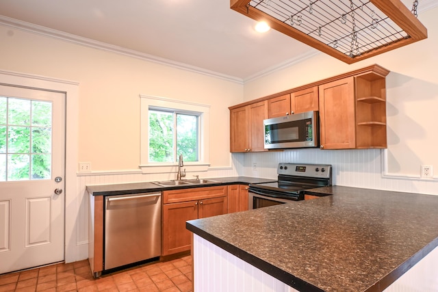 18 Colonial Rd Unit 18, Portland, ME 04102 - kitchen featuring appliances with stainless steel finishes, crown molding, open shelves, a peninsula, and brown cabinetry