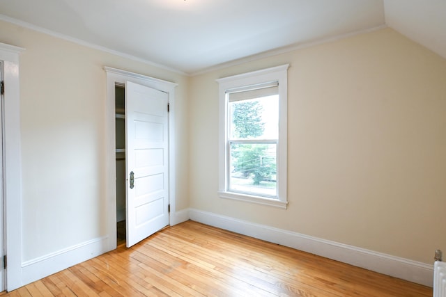 18 Colonial Rd Unit 18, Portland, ME 04102 - unfurnished bedroom with light wood-style floors and crown molding