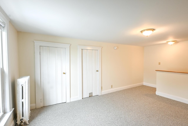 18 Colonial Rd Unit 18, Portland, ME 04102 - below grade area featuring radiator and carpet flooring