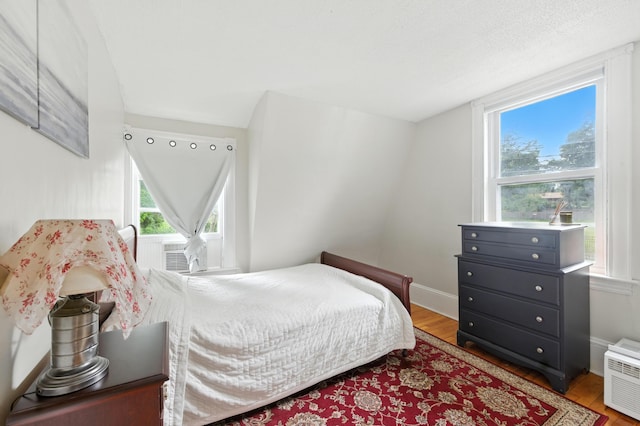 214 S Main St, Auburn, ME 04210 - bedroom featuring light wood finished floors and cooling unit