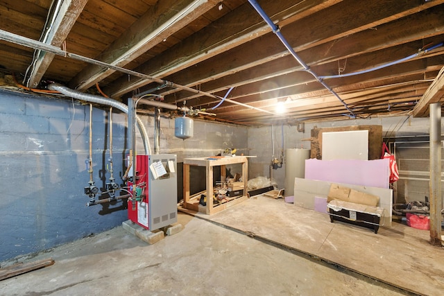 214 S Main St, Auburn, ME 04210 - unfinished basement featuring water heater and a heating unit