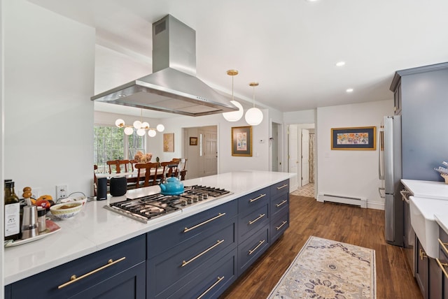 6 Beechwood Ln, Falmouth, ME 04105 - kitchen featuring appliances with stainless steel finishes, wall chimney range hood, blue cabinetry, a baseboard radiator, and recessed lighting
