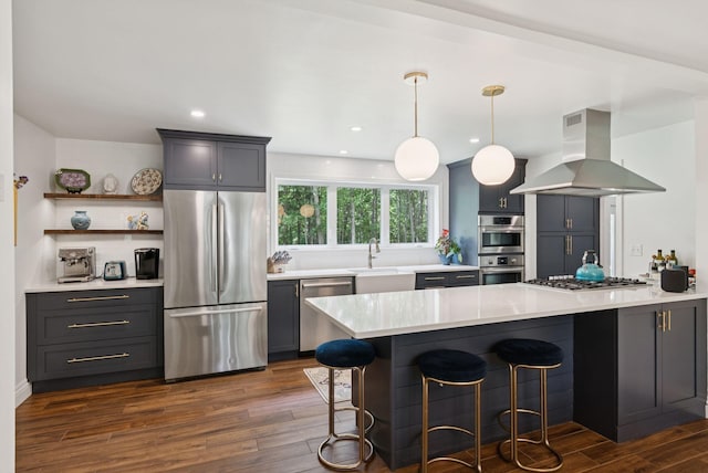 6 Beechwood Ln, Falmouth, ME 04105 - kitchen with stainless steel appliances, island exhaust hood, a breakfast bar, dark wood-style flooring, and recessed lighting
