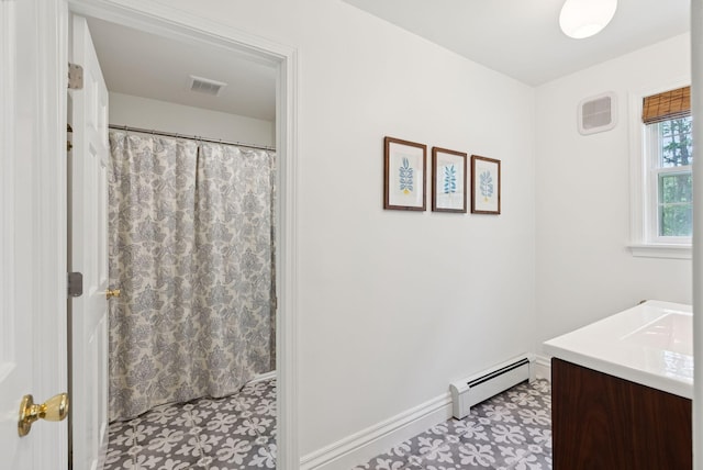 6 Beechwood Ln, Falmouth, ME 04105 - bathroom featuring a baseboard heating unit, vanity, curtained shower, and tile patterned floors