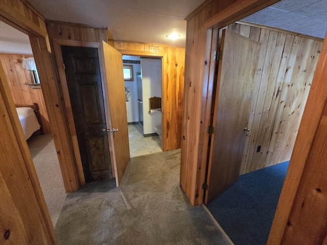 83 Milts Way, Lincoln, ME 04457 - corridor with wooden walls and carpet flooring