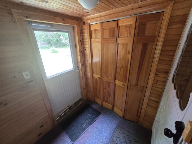 83 Milts Way, Lincoln, ME 04457 - doorway to outside featuring wooden ceiling and dark carpet