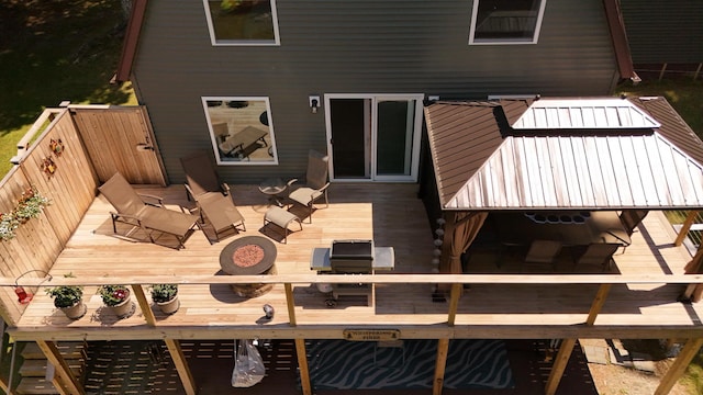 52 Ludden Ln, Lincoln, ME 04457 - rear view of house with a deck and outdoor dining area
