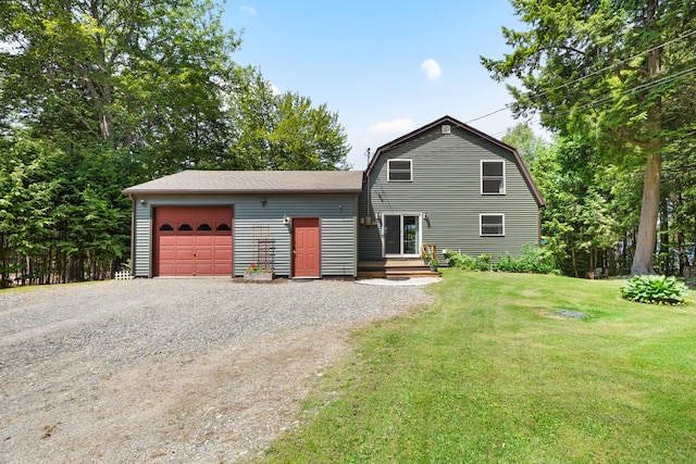52 Ludden Ln, Lincoln, ME 04457 - dutch colonial with gravel driveway, a garage, a front lawn, and a gambrel roof