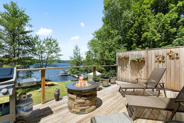 52 Ludden Ln, Lincoln, ME 04457 - wooden terrace with a fire pit and a water view