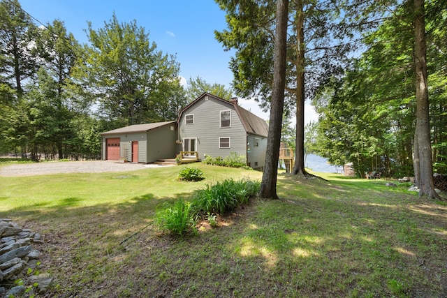 52 Ludden Ln, Lincoln, ME 04457 - view of side of property with a gambrel roof, a yard, a chimney, a garage, and driveway