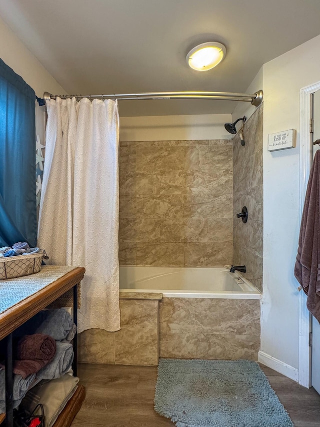 27 Main St, Vassalboro, ME 04989 - full bathroom with a combined bath / shower with marble appearance and wood finished floors