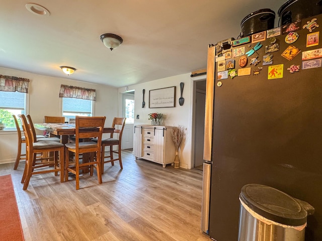 27 Main St, Vassalboro, ME 04989 - dining room featuring light wood-type flooring and baseboards