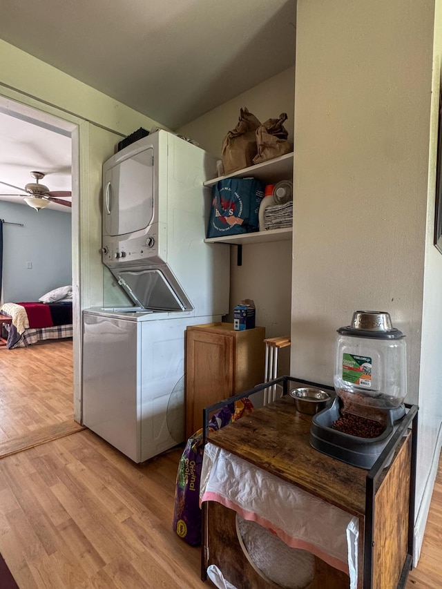27 Main St, Vassalboro, ME 04989 - washroom with stacked washer / drying machine, light wood-style flooring, and a ceiling fan