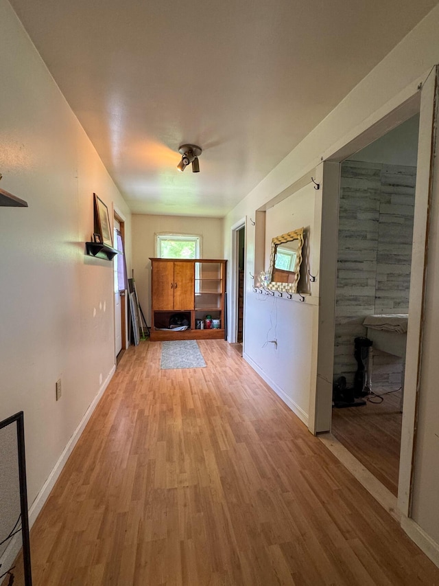 27 Main St, Vassalboro, ME 04989 - unfurnished living room featuring light wood finished floors and baseboards