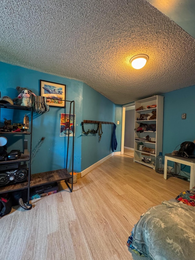 27 Main St, Vassalboro, ME 04989 - interior space featuring wood finished floors, a textured ceiling, and vaulted ceiling