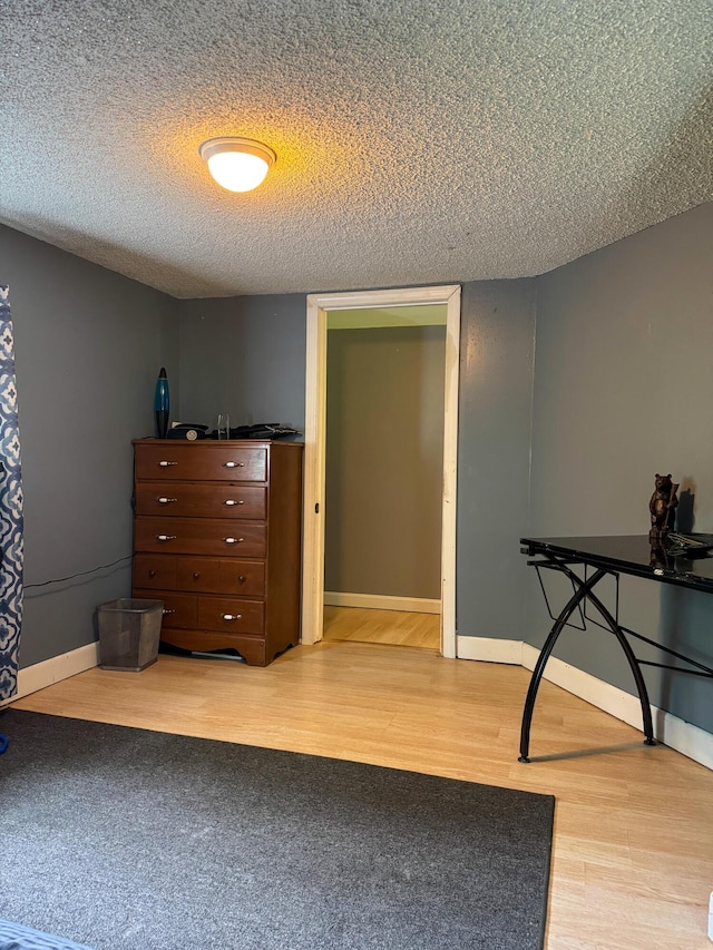 27 Main St, Vassalboro, ME 04989 - bedroom featuring wood finished floors and a textured ceiling