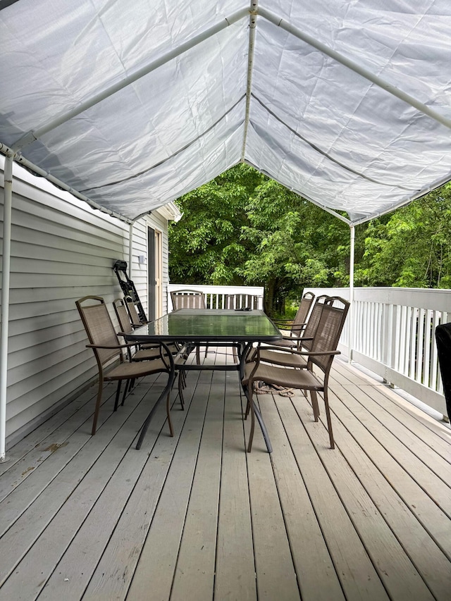 27 Main St, Vassalboro, ME 04989 - wooden terrace with outdoor dining area