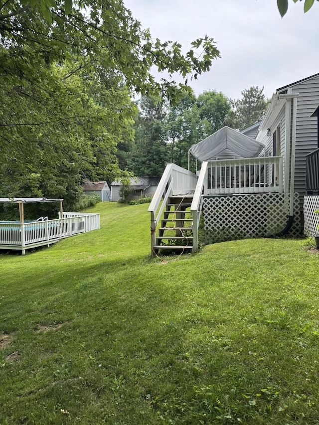 27 Main St, Vassalboro, ME 04989 - view of green lawn with stairway and a wooden deck