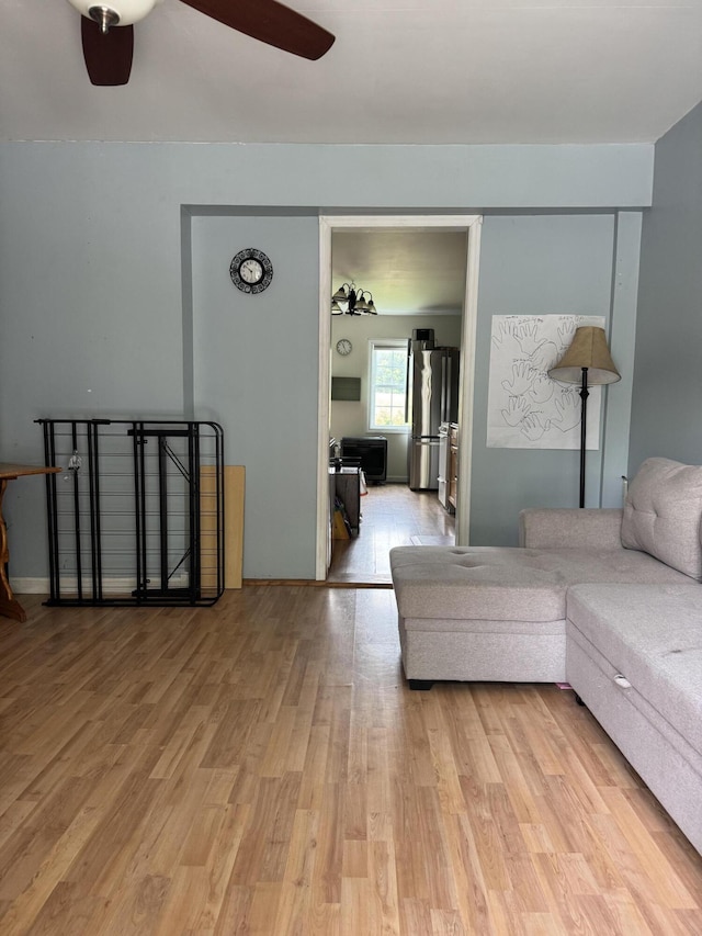 27 Main St, Vassalboro, ME 04989 - living room with a ceiling fan and wood finished floors
