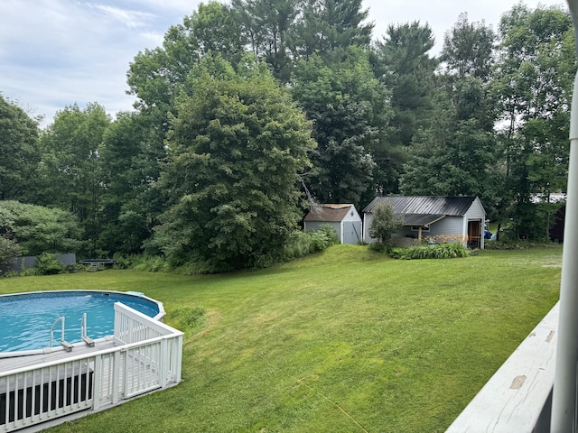 27 Main St, Vassalboro, ME 04989 - view of grassy yard with a storage shed and an outdoor pool