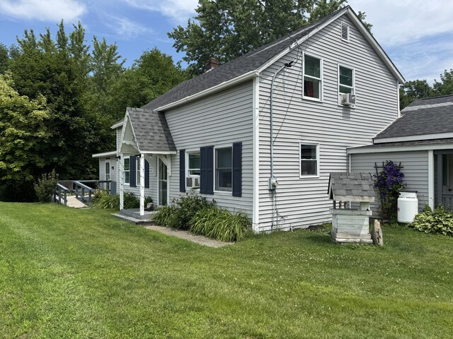 27 Main St, Vassalboro, ME 04989 - back of property featuring a yard, roof with shingles, and a chimney