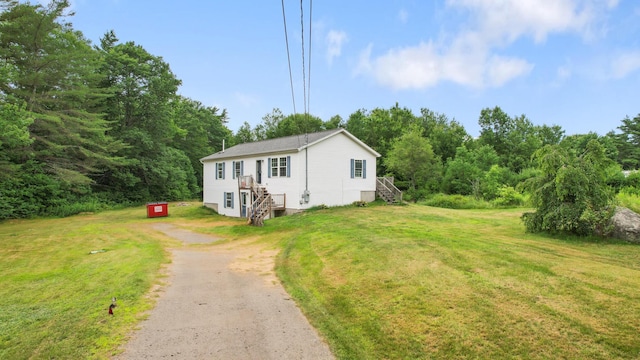 32 Barton Rd, Windsor, ME 04363 - view of front of property featuring driveway, a front yard, and stairway