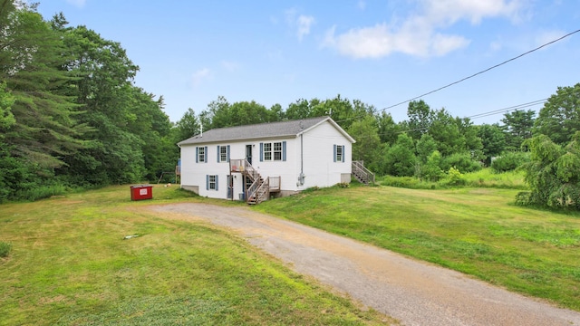 32 Barton Rd, Windsor, ME 04363 - view of front of house with stairs, driveway, and a front lawn