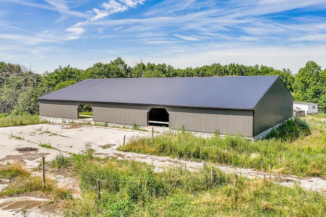 672 Brooks Rd, Knox, ME 04986 - view of home's exterior featuring an outbuilding, an outdoor structure, and a metal roof
