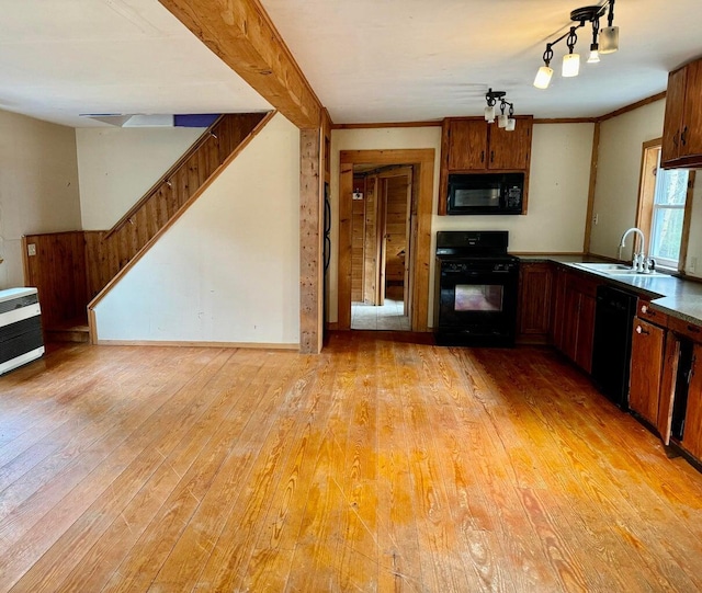 5 Abagail Rock Rd, Vinalhaven, ME 04863 - kitchen with black appliances, light wood finished floors, and brown cabinetry