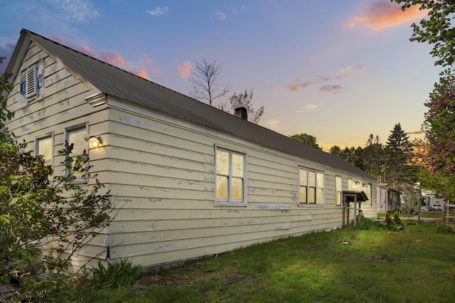138 Main St, Brownfield, ME 04010 - view of side of property featuring a metal roof and a lawn