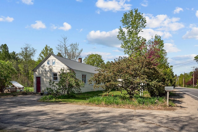 138 Main St, Brownfield, ME 04010 - view of side of home featuring a chimney