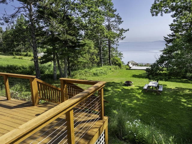 585 N Lubec Rd, Lubec, ME 04652 - wooden deck featuring a water view, a fire pit, and a lawn